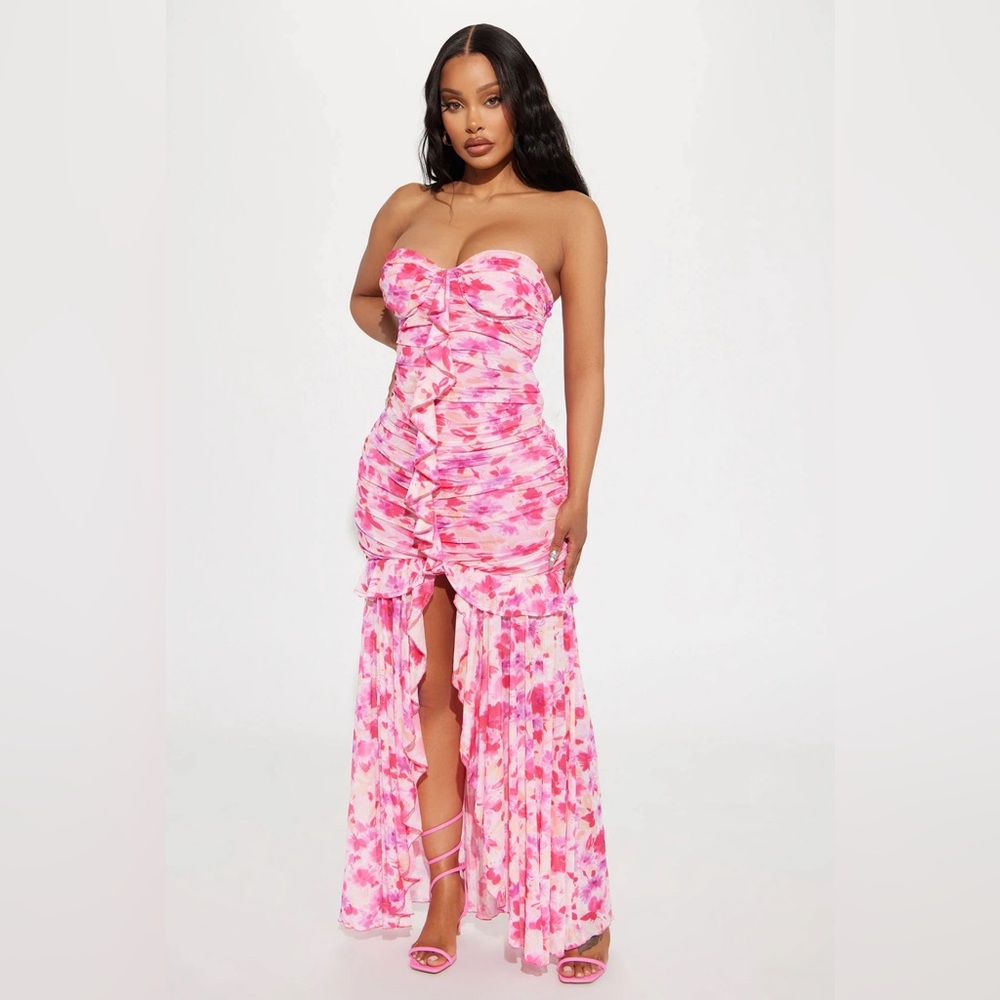 A pink and white maxi dress with a slit in the middle